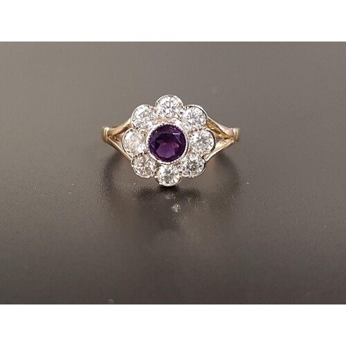 AMETHYST AND DIAMOND CLUSTER RING the central round cut amet...