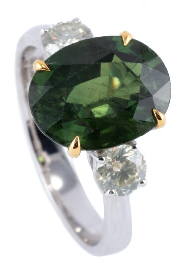 AN 18CT WHITE GOLD SAPPHIRE AND TWO DIAMOND RING; featuring an oval cut green treated sapphire of 5.36ct (few small chips), adjacent...