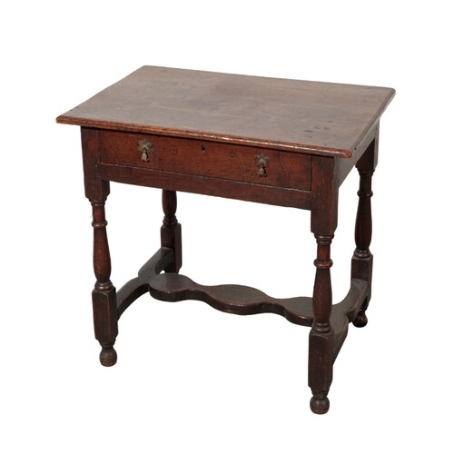 AN OAK SIDE TABLE early 18th century, with a single frieze d...