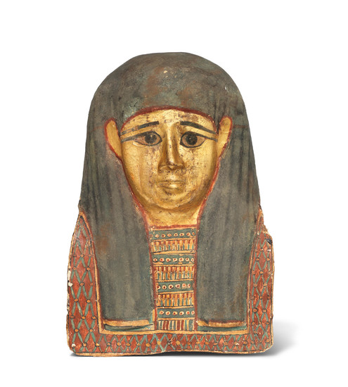 An Egyptian gilt and polychrome painted cartonnage mummy mask