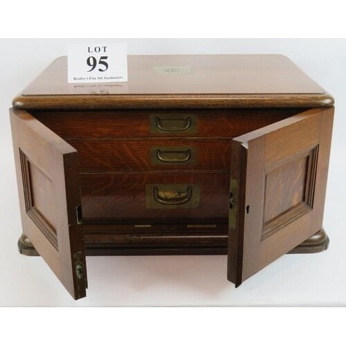 An early 20th Century 3 drawer oak canteen by Walker & Hall,...