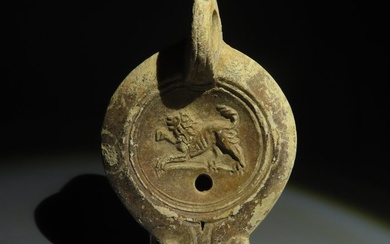 Ancient Roman Terracotta Oil Lamp with a lion. 1st-3rd century AD. 11 cm length.