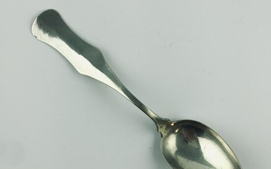Colonial spoon in beaten silver