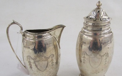 George V silver sugar caster and matching cream jug, each fl...