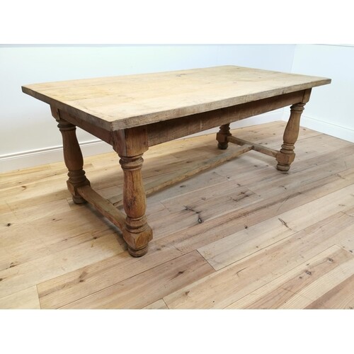 Good quality bleached oak kitchen table raised on turned leg...