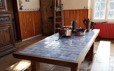 Large kitchen table in wood and earthenware tiles...