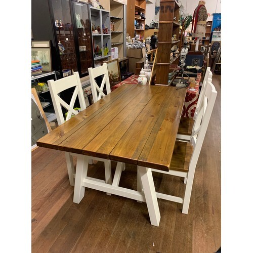 Modern solid wood dining table with 4 matching chairs.