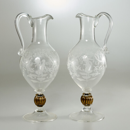 Nice pair etched colorless glass pedestal ewers