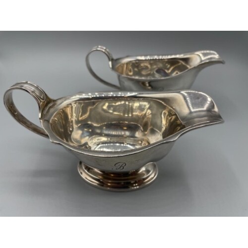 Pair of Sterling silver sauce boats with engraved handles. B...