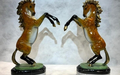 Pair of bronze sculptures depicting rearing horses