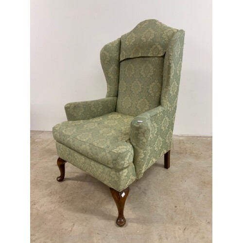 Queen Anne style wing back arm chair in green upholstery