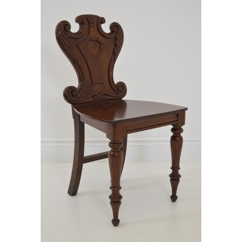 Regency carved mahogany hall chair raised on turned legs {84...