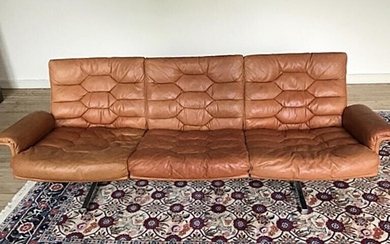 NOT SOLD. Robert Hausmann: Three seater sofa with runners legs, upholstered with patinated leather. H. 68 L. 180 cm. – Bruun Rasmussen Auctioneers of Fine Art