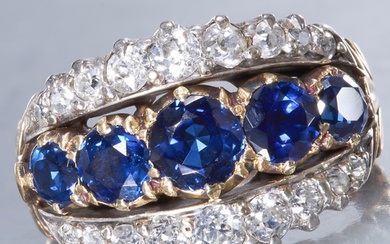 SAPPHIRE AND DIAMOND RING. Set with vibrant sapphires totall...