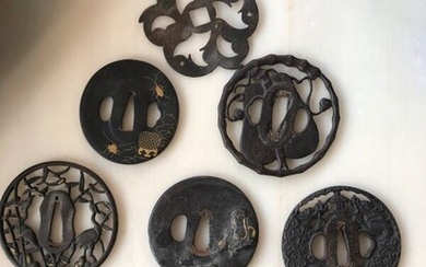 Set of eight tsuba ; One polylobed element is attached