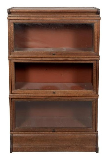 THREE-SECTION BARRISTER'S BOOKCASE Early 20th Century Height 55”. Width 34”. Depth