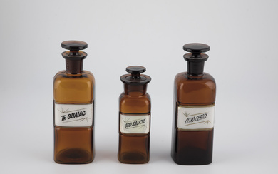 Three Apothecary Jars 20th century brown glass, with stoppers and labels. H. 17 ...