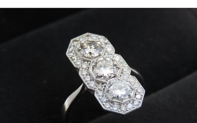 Three Stone Diamond Ring with Further Diamond Halo Decoratio...