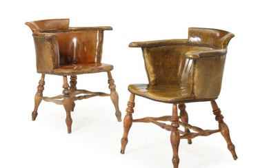 Two 19th century captains armchairs, upholstered with light brown leather. (2)