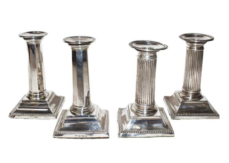 Two Pairs of Edward VII Silver Candlesticks, the first pair...