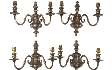 Two pairs of brass twin light wall appliques, 20th Century, each with scrolling arms, 31cm high (4) It is the buyer's responsibility to ensure that electrical items are professionally rewired for use.