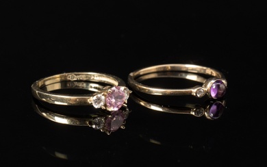 Two rings of 8 kt gold with cubic zirconia & amethyst (2)