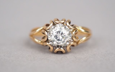 Yellow gold ring, decorated in its centre with a diamond...