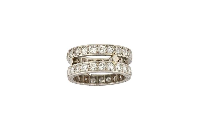 A double diamond eternity ring Composed of two rings,...