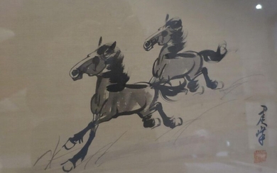 20th China. Ink painting on silk representing two galloping horses, inscription and stamp at bottom right, framed.