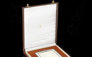 A large silver-mounted and guilloché enamel mahogany photograph frame