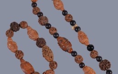 A Chinese carved nut bead necklace and bracelet