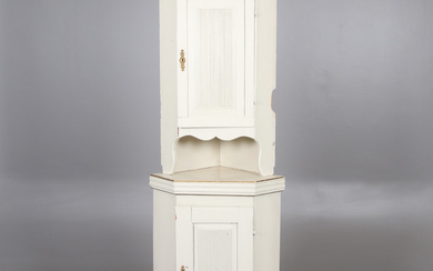 A 19th century corner cabinet.