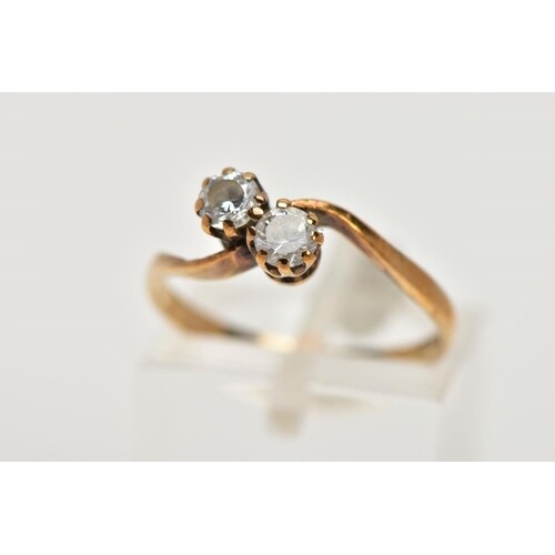 A 9CT GOLD CUBIC ZIRCONIA RING, of a cross over design, set ...