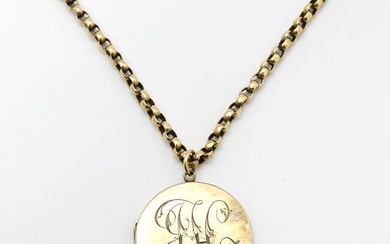 A 9ct gold and yellow metal chain set with circular yellow metal pendant locket. Pendant approx. 1