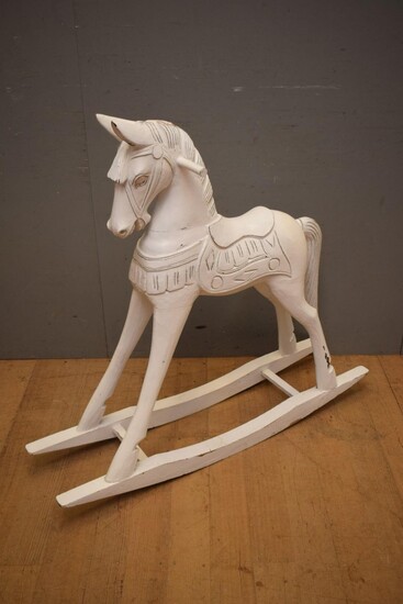 A CARVED TIMBER ROCKING HORSE (A/F) (104H x 29W x 114D CM) (LEONARD JOEL DELIVERY SIZE: LARGE)
