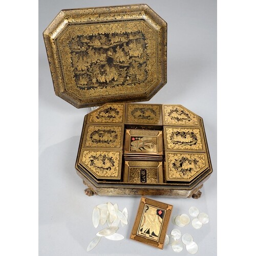 A CHINESE EXPORT BLACK AND GOLD LACQUER GAMES BOX AND COVER,...