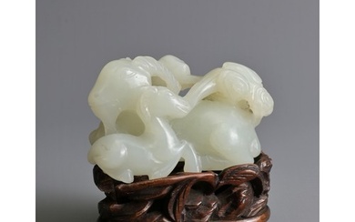 A CHINESE WHITE JADE DEER GROUP ON WOODEN STAND, 19/20TH CEN...