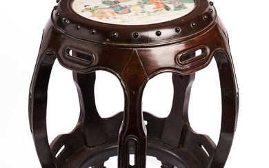 A CHINESE WOOD DRUM STOOL INSET WITH A FAMILLE-VERTE PLAQUE, QING DYNASTY, CIRCA 1900