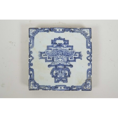 A Chinese blue and white porcelain tile decorated with a sty...