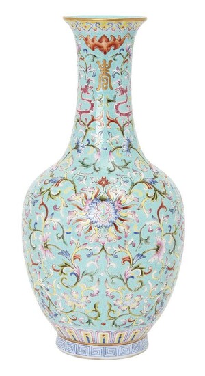 A Chinese porcelain turquoise ground bottle vase, Qianlong mark but late Republic/mid-20th century, painted in famille rose enamels with lotus blooms and meandering leafy scrolls, the neck painted in puce with confronting archaistic kui dragons...