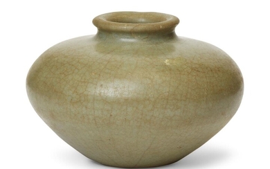 A Chinese stoneware celadon-glazed jarlet, Ming dynasty, of compressed form, flat unglazed burnished base, 6.5cm high 明 青釉小罐