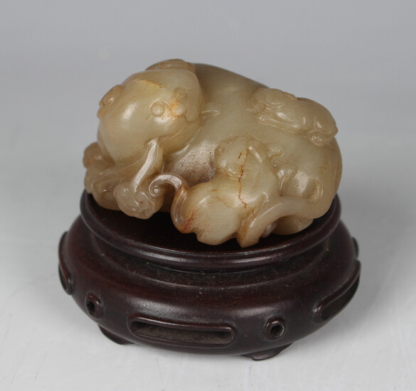 A Chinese yellow jade carving of a Buddhistic lion, Qing dynasty, possibly 18th century, modelled in