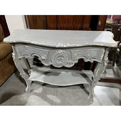 A French style distress decorated serpentine two-tier hall t...