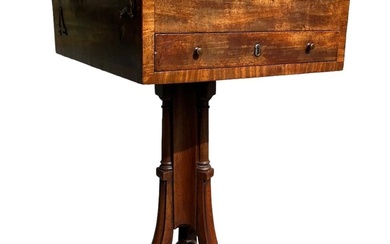 A GEORGE III MAHOGANY PEDESTAL ADJUSTABLE READING/WRITING TABLE The...