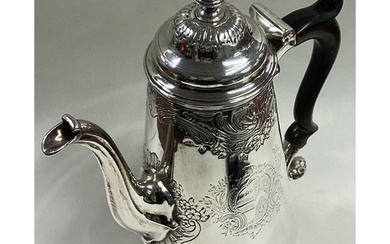 A George II silver coffee pot in the Rococo style with chase...