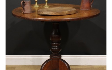 A George III Provincial oak tripod occasional table, circula...