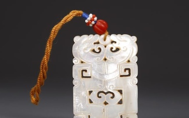 A MOTHER-OF-PEARL DRAGON CARVING PENDANT.