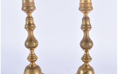 A PAIR OF 19TH CENTURY MIDDLE EASTERN TURKISH BRONZE CANDLES...