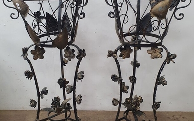 A PAIR OF RAISED WROUGHT IRON PLANTERS