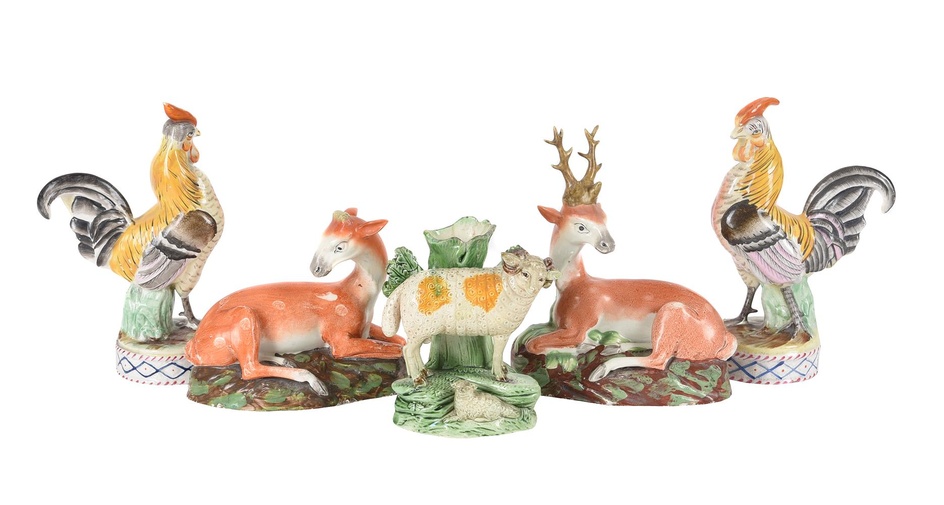 A PAIR OF STAFFORDSHIRE PEARLWARE MODELS OF A RECUMBENT STAG AND DOE, CIRCA 1820